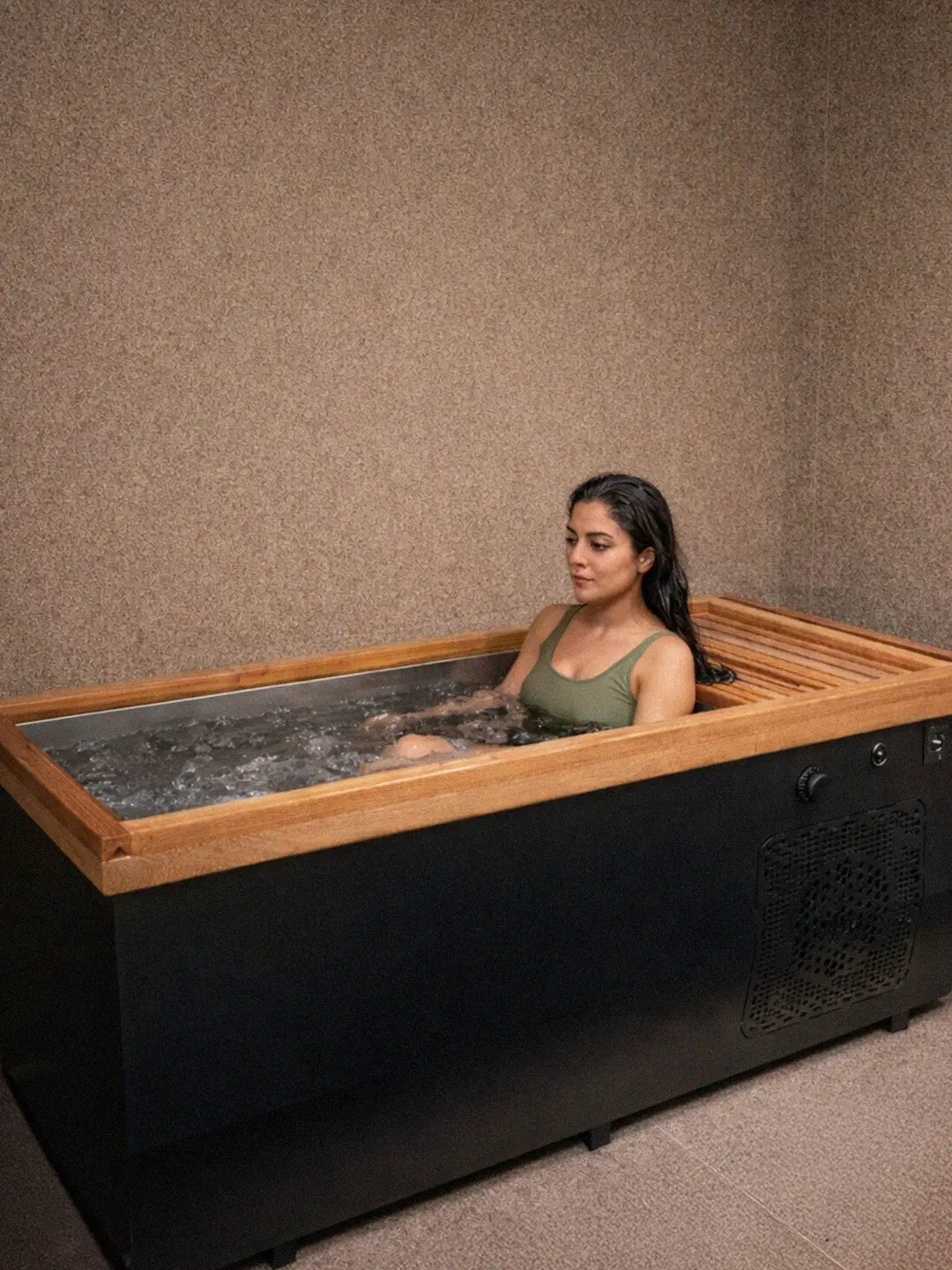 A member in the cold plunge at Vy Boutique