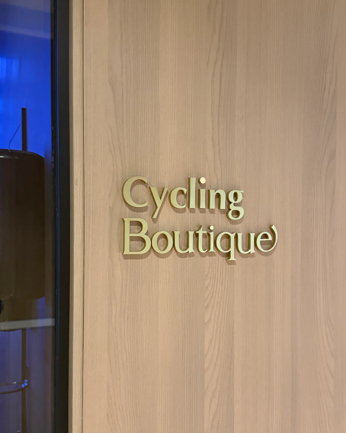 The Cycling Boutique signage in brass on the studio door